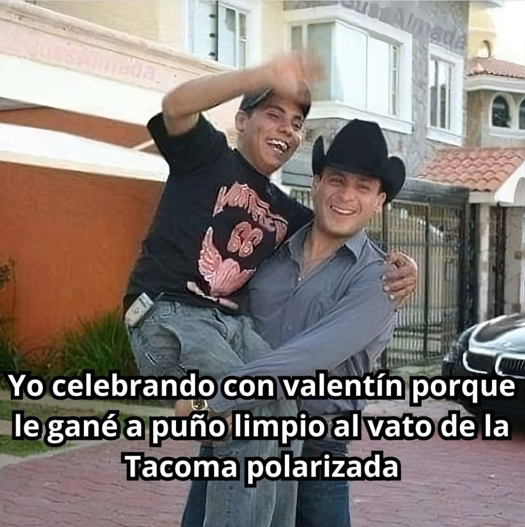 a man is holding a young boy in his arms